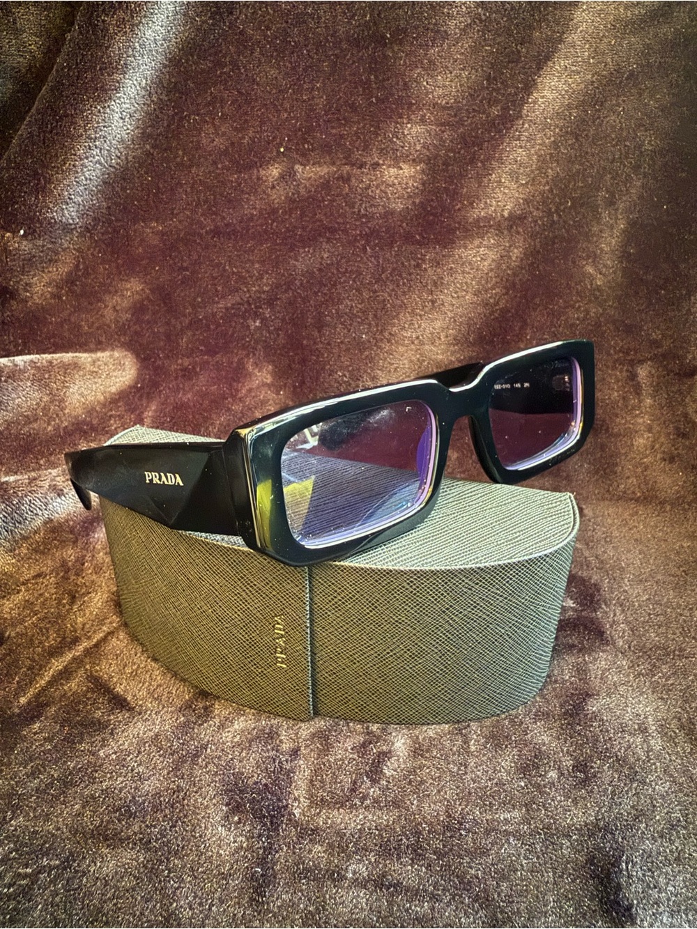 Prada Black sunglasses with violet lens